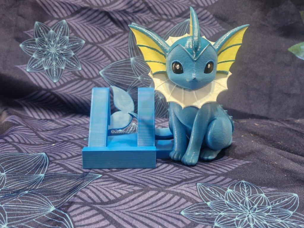 Support téléphone en impression 3D personnalisé avec figurine monstre colorée